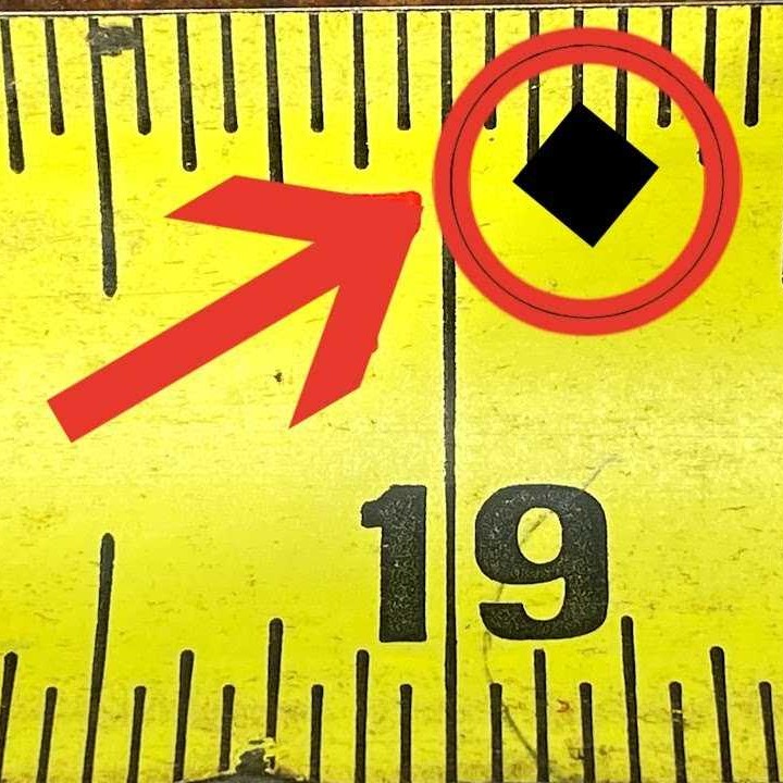 the black diamond on a tape measure for